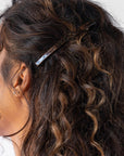 Womens Metallic Brown, long, French Barrette styling side-swept, brown, curly hair. Hair accessory by France Luxe.