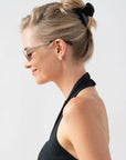 Woman with straight, blonde hair styled in a twist updo with a France Luxe small, Black claw hair clip.