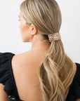 Womens checkered tortoise, large Barrette, ideal for thick hair, seen styling pulled back, blonde, straight hair.