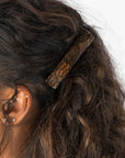 Womens metallic brown, French Barrette, ideal for most hair types, seen styling side-swept, brown, curly hair.