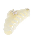 Hair clip with a decorative flower on a white background