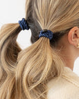 L. Erickson Blue, no damage hair ties, styling blonde, straight, pigtail ponytails.