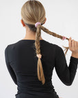 Pink hair ties styling a cute double braided ponytail. L. Erickson Grab & Go Pony, Tutu.