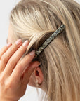 Womens Silver French Barrette styling side-swept, blonde, straight hair. Hair accessory by France Luxe.
