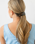 Womens classic tortoiseshell, large Barrette, ideal for thick hair, seen styling pulled back, blonde, straight hair.