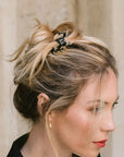 France Luxe Ivory Tortoiseshell Mini Claw Hair Clip holding straight, blonde hair back in a loose bun.