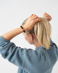L. Erickson Black & Rose Gold, no damage hair ties, styling blonde, straight, ponytail.