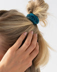 L. Erickson thick hair ties, styling blonde, straight, loose, half up bun. Blue hair bands