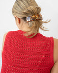 France Luxe Brown Large Barrette holding straight, blonde hair back in a loose twist.