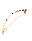 Side view of a checkered tortoise France Luxe large barrette, with a spacious clasp for thick hair.