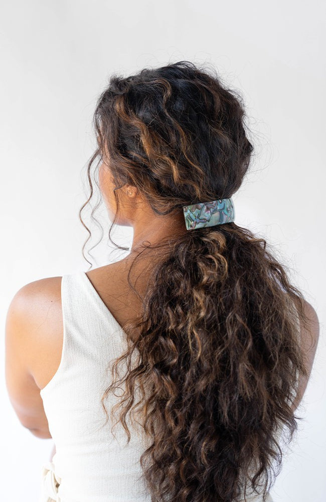 Womens light blue, large Barrette, ideal for thick hair, seen styling pulled back, brown, curly hair.