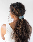 Womens light blue, large Barrette, ideal for thick hair, seen styling pulled back, brown, curly hair.