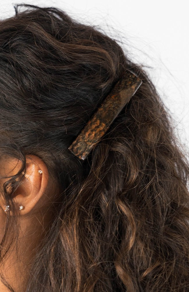Womens metallic brown, French Barrette, ideal for most hair types, seen styling side-swept, brown, curly hair.