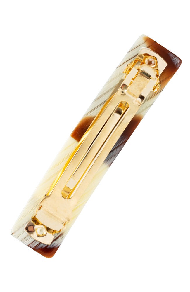 Medium French barrette in Natural Horn, ivory, caramel, and chestnut blend, ideal for most hair types.