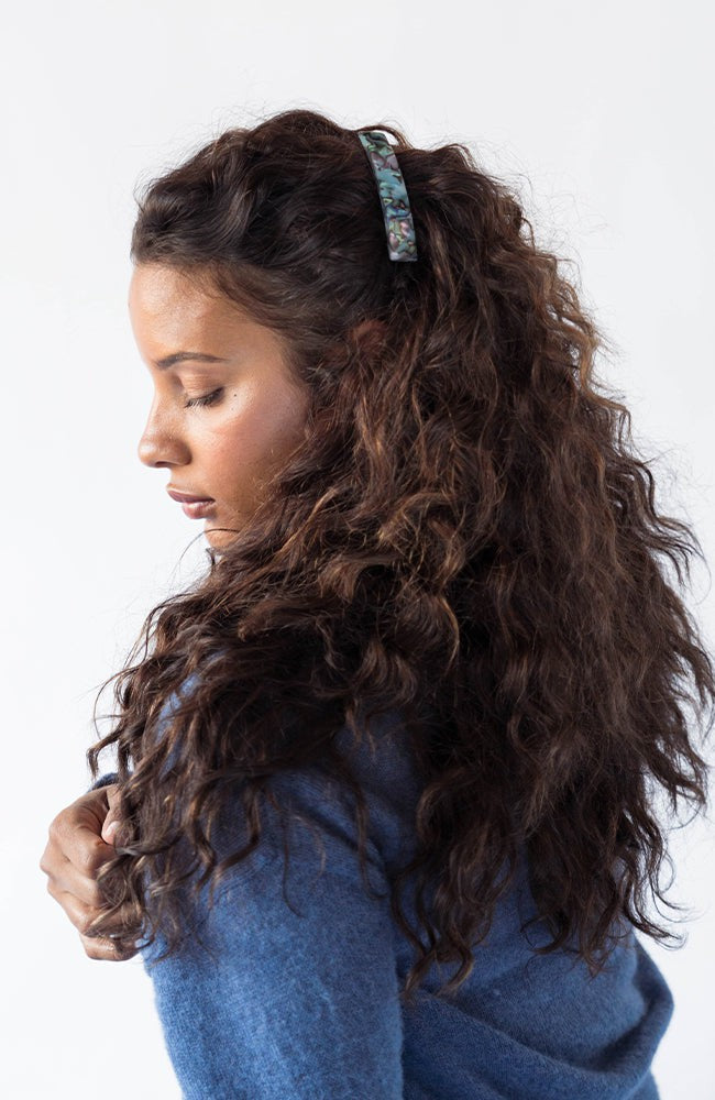 Womens light blue, French Barrette, ideal for most hair types, seen styling side-swept, brown, curly hair.