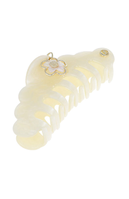 Hair clip with a decorative flower on a white background
