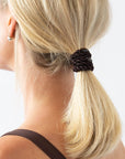 Brown hair ties styling a cute low ponytail, straight, blonde hair. L. Erickson Grab & Go Pony, Camelback.