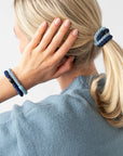 L. Erickson thick hair ties, styling blonde, straight, low ponytail. Blue hair bands