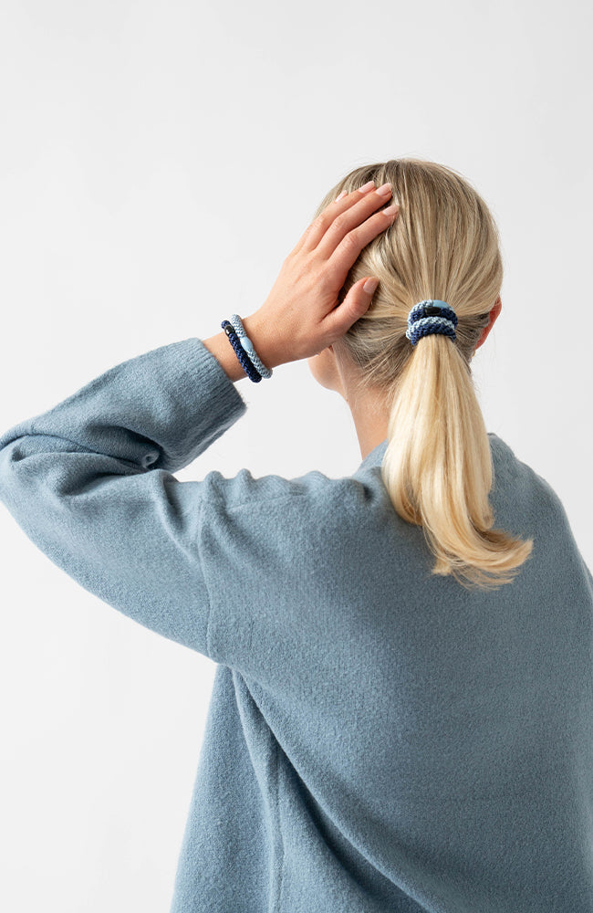 L. Erickson Blue, no damage hair ties, styling blonde, straight, low ponytail.