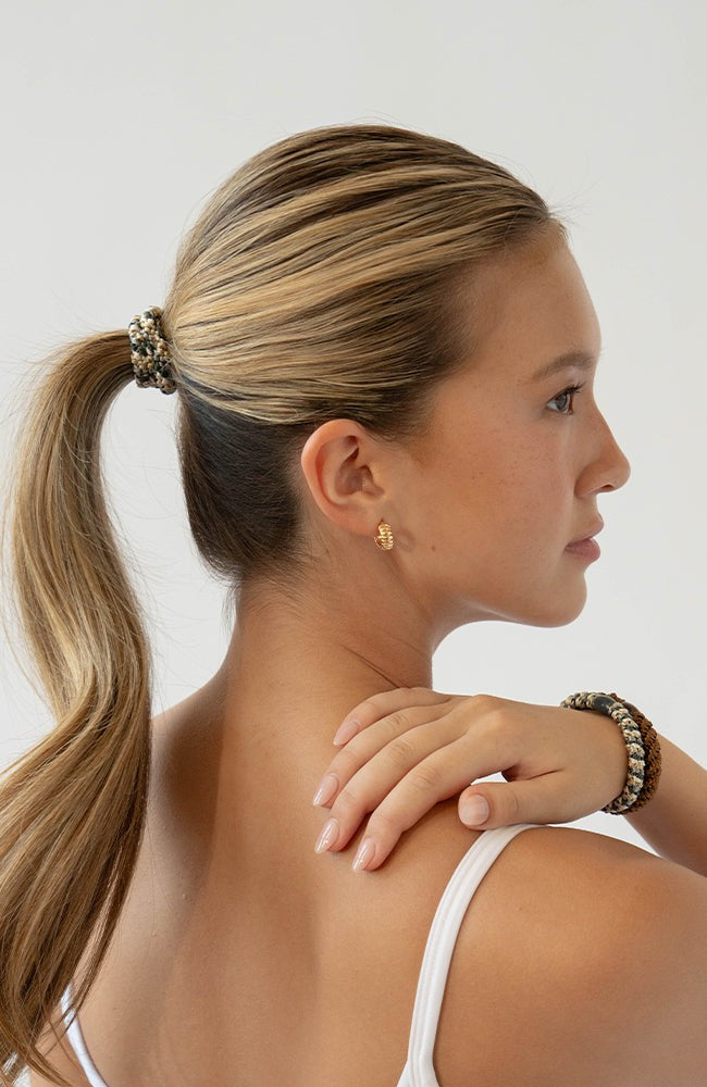 Thick hair ties with style. Woman using L. Erickson ponytail holders in her ponytail.