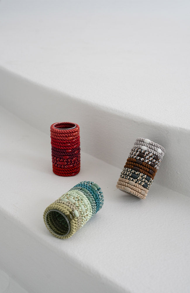 L. Erickson thick hair tie tube packs. Strong, no-damage ponytail holders in green packs.