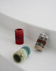 L. Erickson thick hair tie tube packs. Strong, no-damage ponytail holders in green packs.