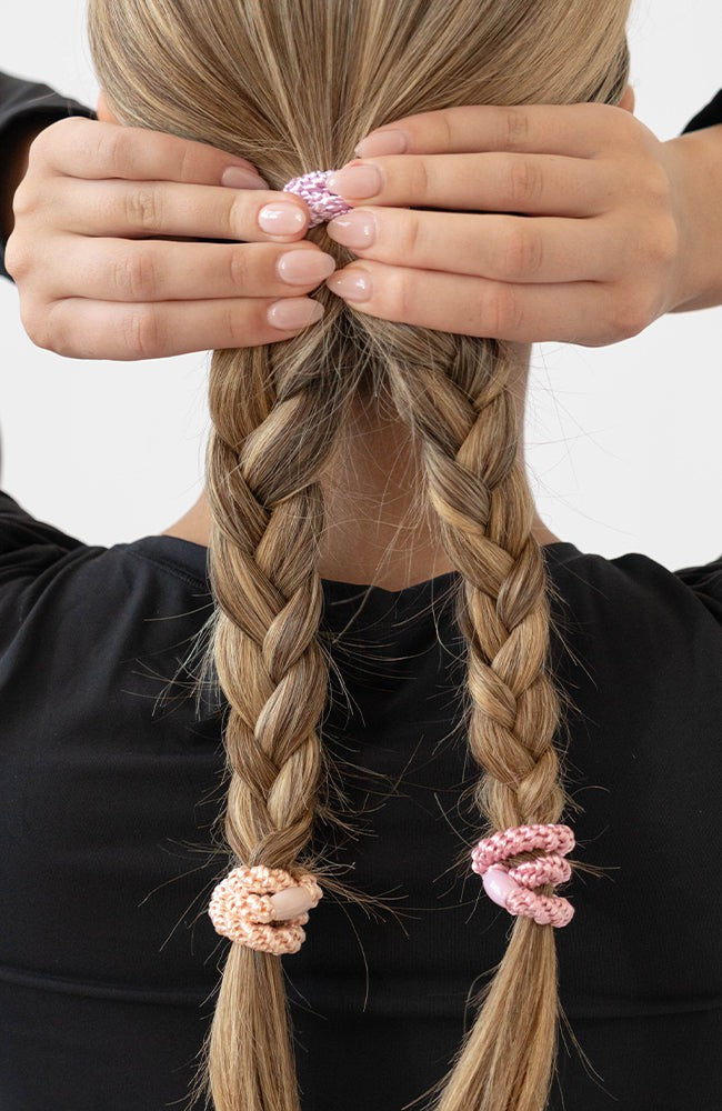 Pink hair ties styling a straight double braided ponytail. L. Erickson Grab &amp; Go Pony, Tutu.