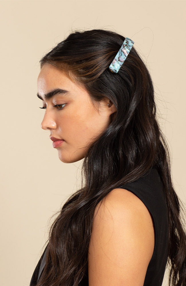 Womens light blue, French Barrette, ideal for most hair types, seen styling side-swept, black, straight hair.