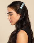Womens light blue, French Barrette, ideal for most hair types, seen styling side-swept, black, straight hair.