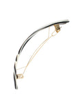 Side view of a black & white France Luxe large barrette, with a spacious clasp for thick hair.