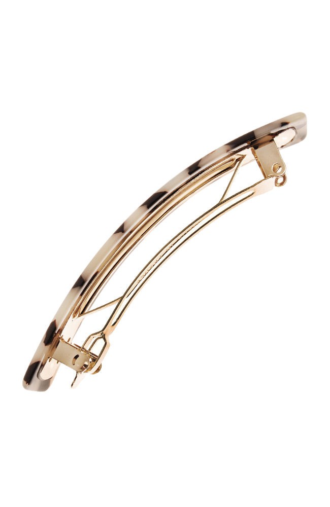 Side view of a ivory tortoiseshell France Luxe Classic French Barrette, ideal for most hair types.