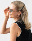 Womens Black French Barrette styling side-swept, blonde, straight hair. Hair accessory by France Luxe.