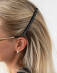 Womens Black French Barrette styling side-swept, blonde, straight hair. Hair accessory by France Luxe.