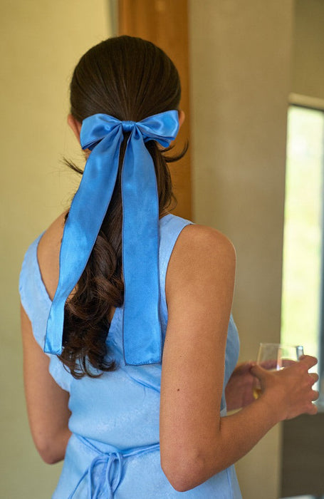 Blue silk bow hair clip styling long brown hair, Long Tail Bow Barrette, Silk Charmeuse French Blue by L. Erickson USA, handmade in America