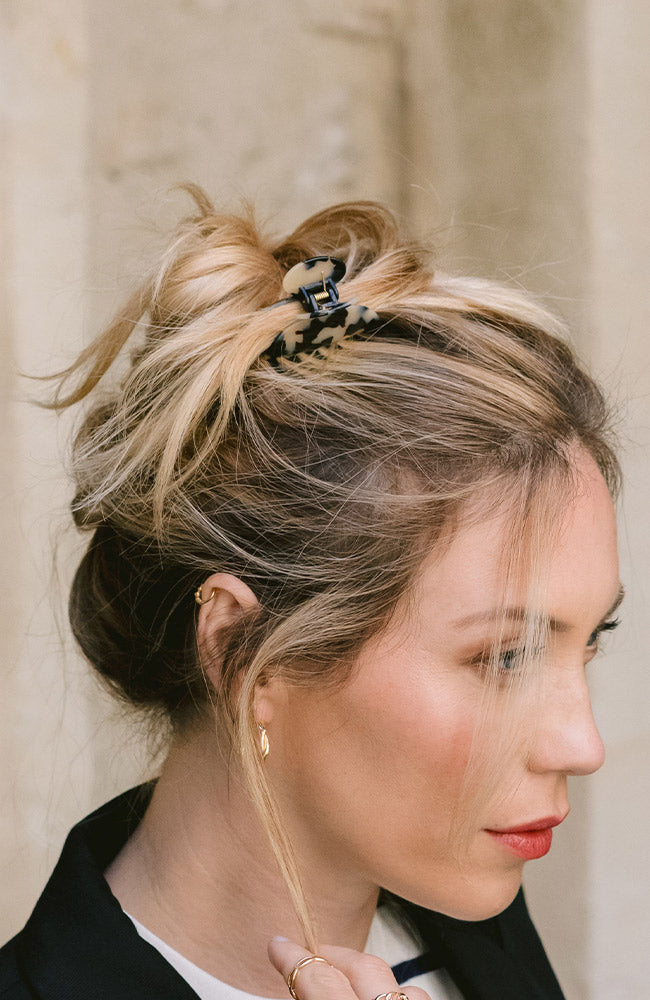 France Luxe Ivory Tortoiseshell Mini Claw Hair Clip holding straight, blonde hair back in a loose bun.