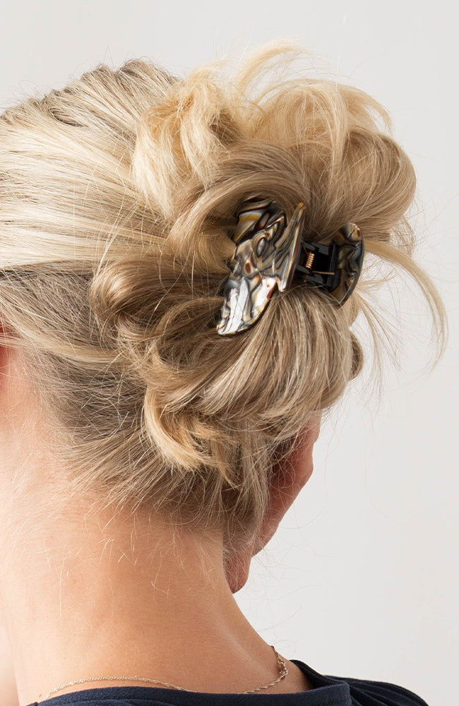 Woman with straight, blonde hair styled in a twist updo with a France Luxe small, Grey claw hair clip.