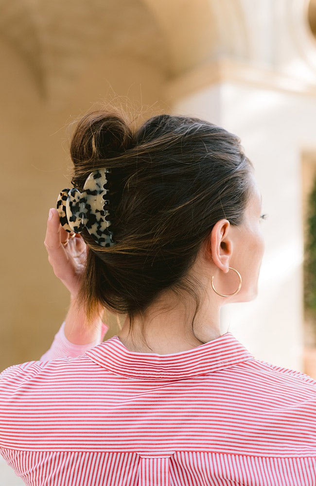 Woman with straight, brown hair styled in a twist updo with a France Luxe medium, Ivory Tortoiseshell claw hair clip.