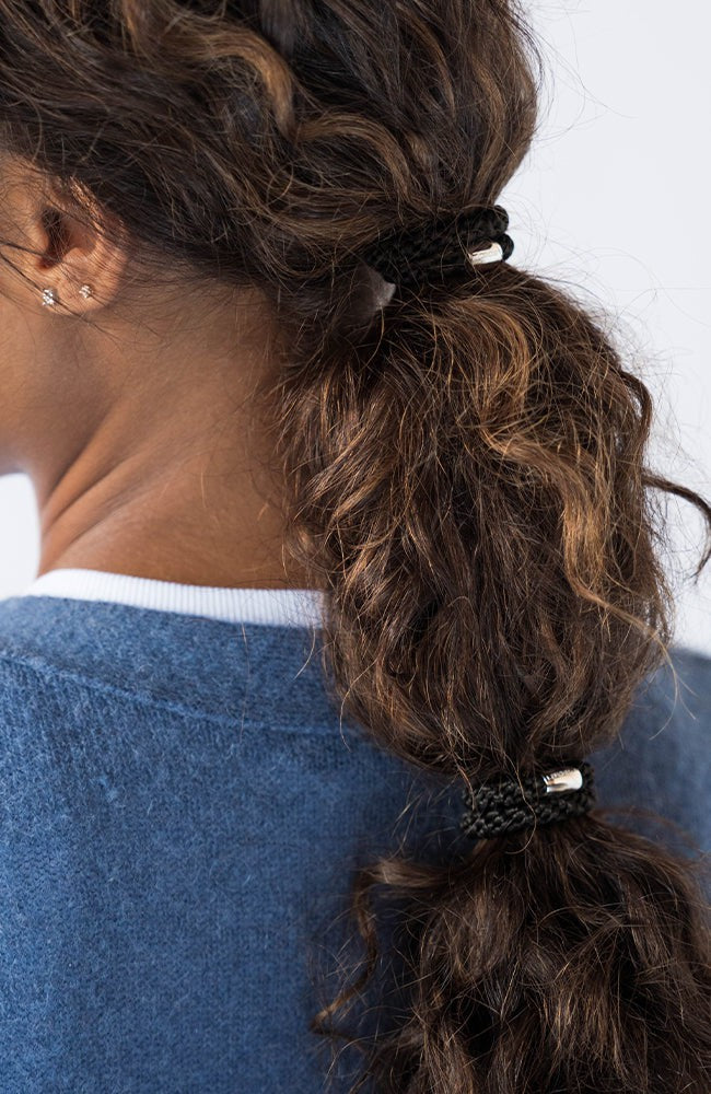 L. Erickson thick hair ties, Black bands with silver accent bead. Strong, durable, damage-free.