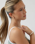 L. Erickson hair ties for thick hair, styling light brown, straight, ponytail.