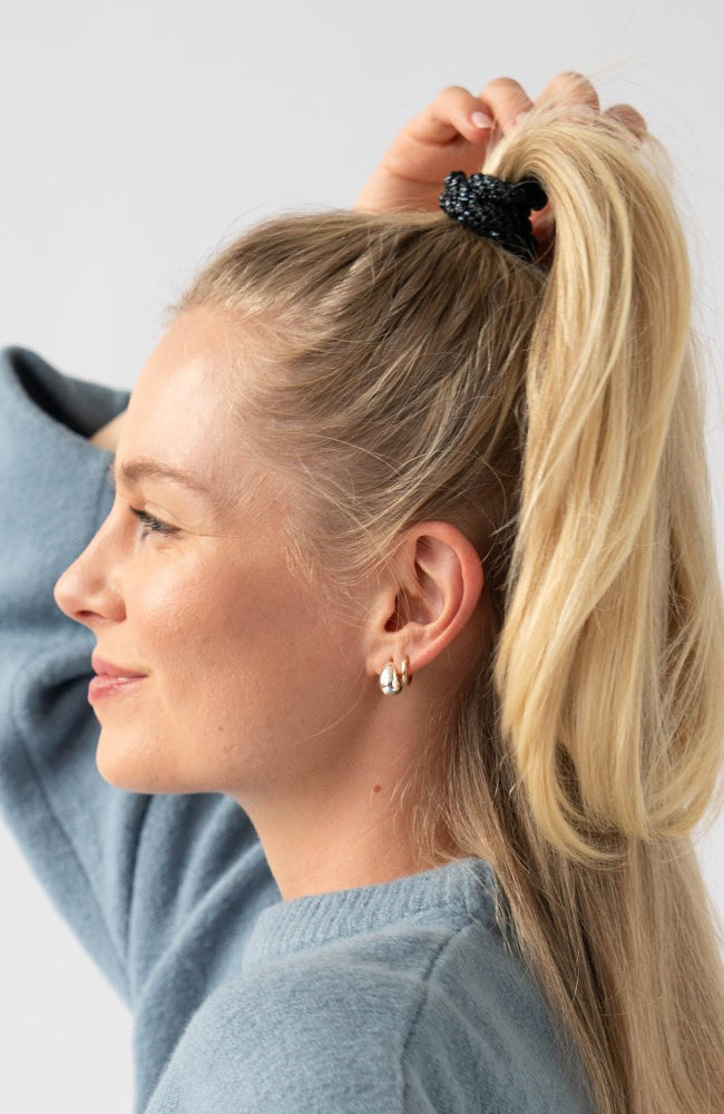 Black hair ties styling a half up, high ponytail. L. Erickson Grab &amp; Go Pony, Black Opal.