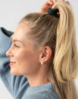 Black hair ties styling a half up, high ponytail. L. Erickson Grab & Go Pony, Black Opal.