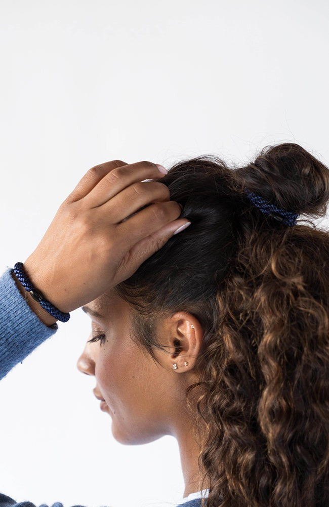 L. Erickson thick hair ties, styling dark brown, voluminous, curly , loose, half up do. Blue hair bands