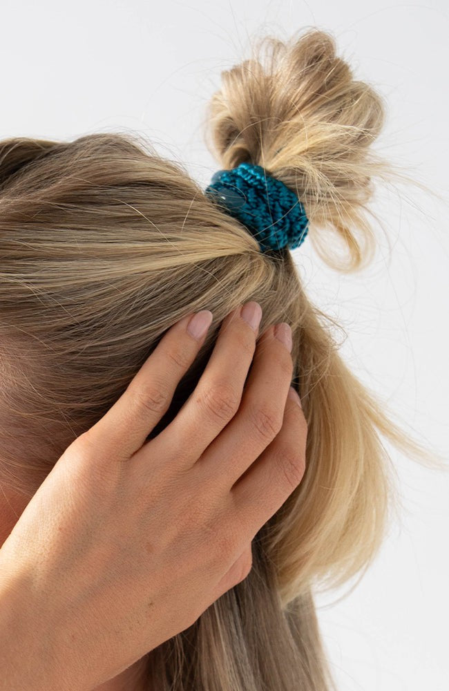 L. Erickson thick hair ties, styling blonde, straight, loose, half up bun. Blue hair bands