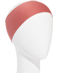 A red rust bandeau headwrap displayed on a mannequin head.