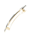 Side view of a black & white France Luxe Classic French Barrette, ideal for most hair types.