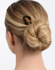 Long blonde hair in bun with Tokyo hair pin