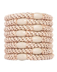 Metallic beige hair ties by L. Erickson.