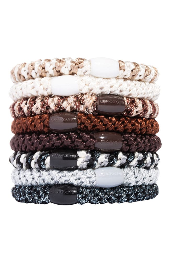 Thick, neutral hair ties by L. Erickson, include white, brown, black.
