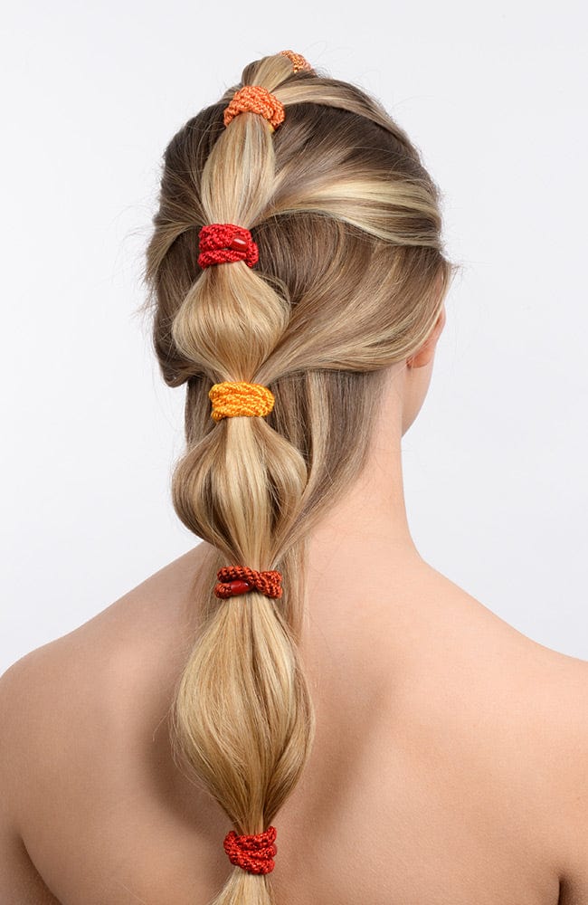 L. Erickson thick hair ties, styling blonde, straight, bubble ponytail. Orange hair bands
